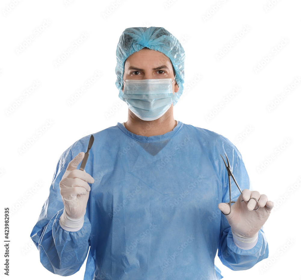 Doctor holding medical clamps and scalpel on light background. Surgical instruments Doctor holding medical clamps and scalpel on light background. Surgical instruments