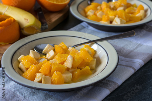 Fruit salad with chopped bananas and oranges