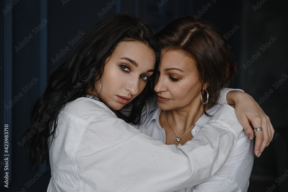 love and tender warm feelings, two adult women, mother and daughter embrace love and tender warm feelings, two adult women, mother and daughter embrace