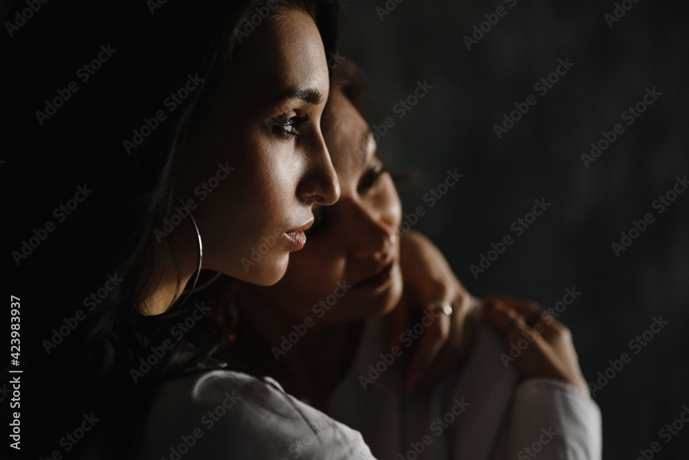 love and tender warm feelings, two adult women, mother and daughter embrace love and tender warm feelings, two adult women, mother and daughter embrace