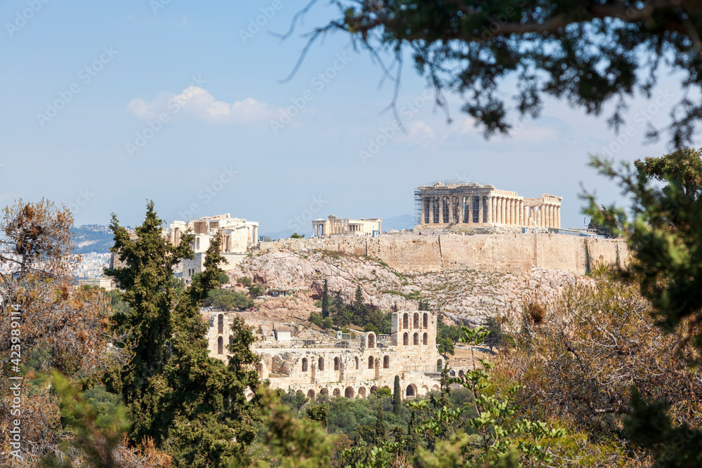 Parthenon view from Filopappou Hill. There can be seen the facade and the southern side of the Parthenon temple, of 5th century BC, on the sacred Akropolis Hill, in Athens, Greece, Europe