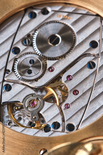 Close-up of the internal clockwork. Selective focus. Macro photography. Gear movement. Time tracking. High quality photo