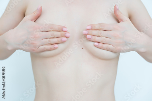 woman examining breast mastopathy or cancer isolated