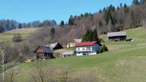 Aerial Approaching Traditional Slovenian House on a Hill, Bed and Breakfast Concept photo