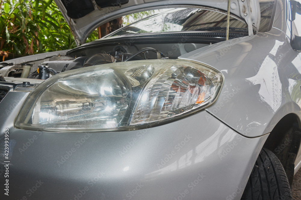 Car or Auto Headlight and Engine in Garage with Natural Light
