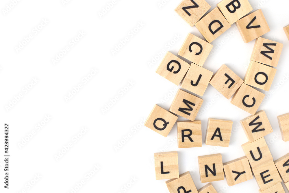 Top view the distribution of letters on wooden tiles scraped in a square shape Isolated on white background. with copy space Top view the distribution of letters on wooden tiles scraped in a square shape Isolated on white background. with copy space