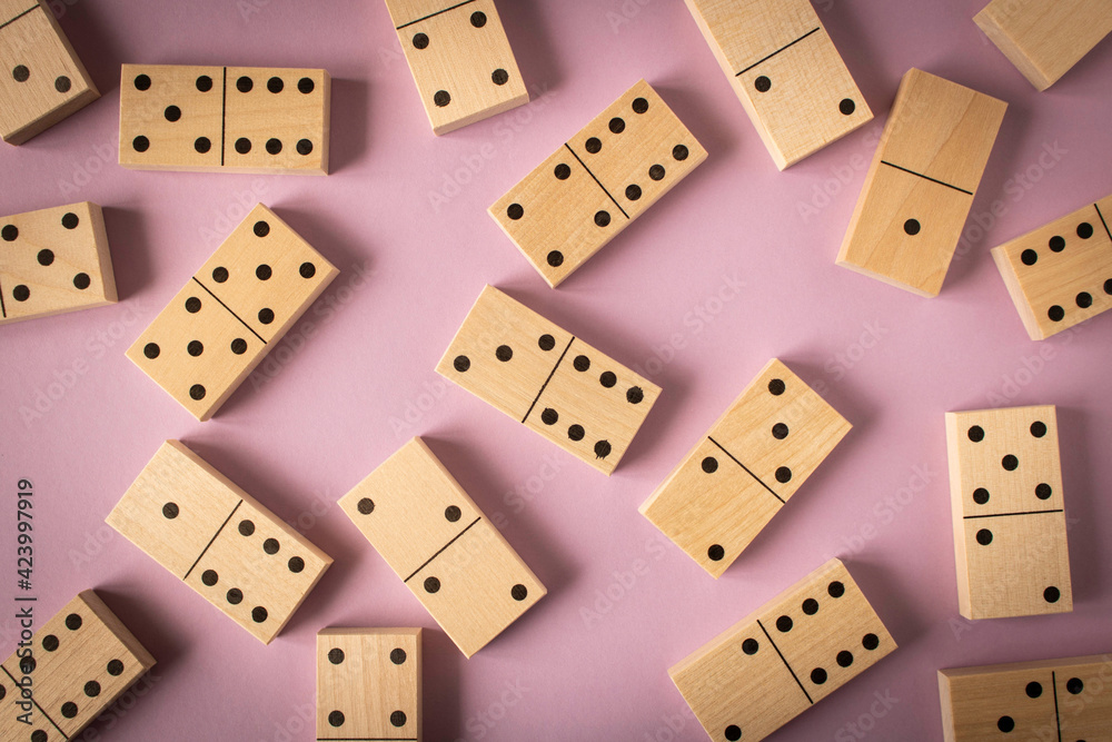 A game of dominoes on a light background. Close-up. Selective focus. A game of dominoes on a light background. Close-up. Selective focus.