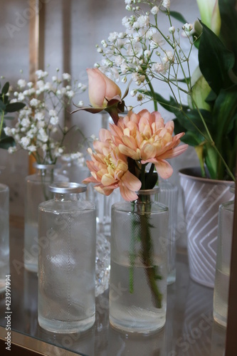Decor with orange chrysanthemum in a glass vase