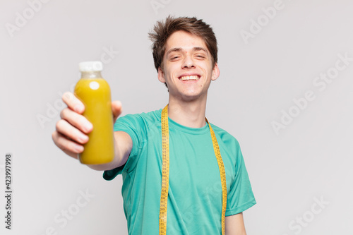 young teenager man happy expression and holding a soothy. diet concept photo