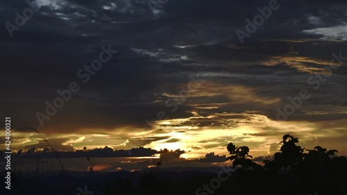 Beatiful sunset with dramatic cloudy sky - time lapse in 4k Zoom in