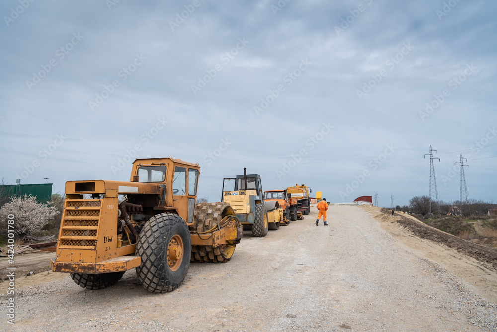 large machines, excavators and rollers for leveling the ground, road construction large machines, excavators and rollers for leveling the ground, road construction