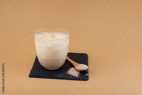 Misutgaru Latte - Korean refreshing drink on beige background with copy space. Popular breakfast drink. Healthy Protein smoothie photo