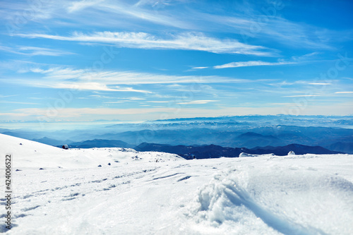 Empty ski chair lift on a mountain - season with no tourists. © astrosystem