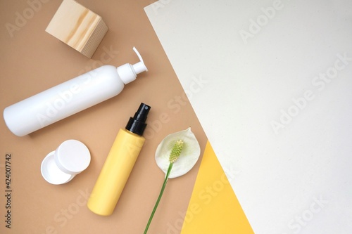 Hair and body products on a pastel beige background. Organic SPA beauty products for hair and body care. Flat lay, top view. beauty products set. 