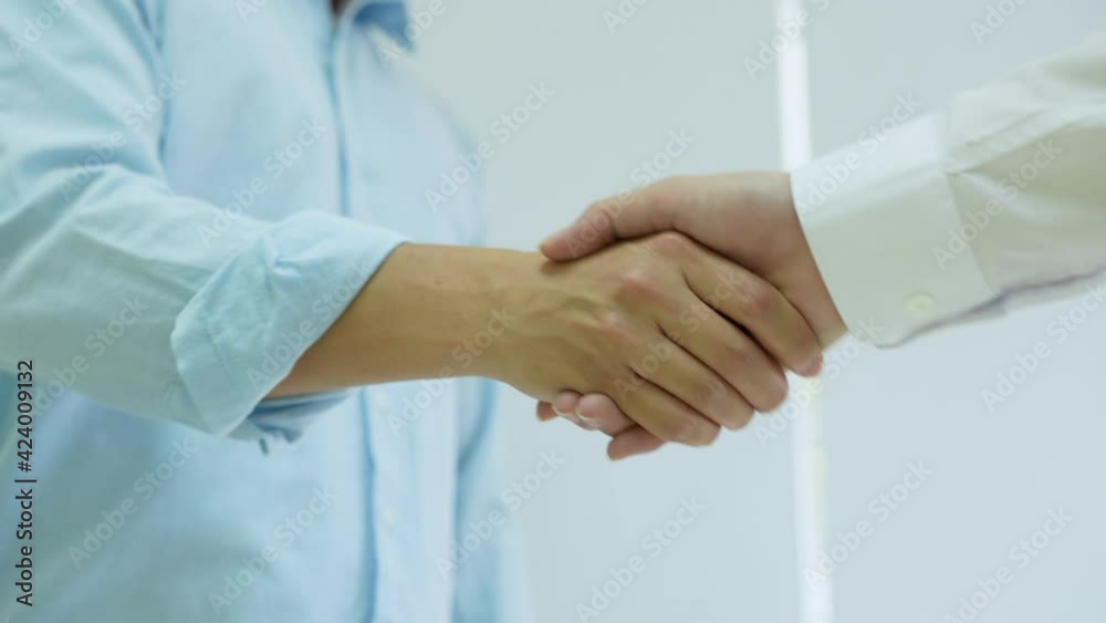 slow motion scene of investor businessman handshake with partner vendor to agreement or deal financial project concept slow motion scene of investor businessman handshake with partner vendor to agreement or deal financial project concept