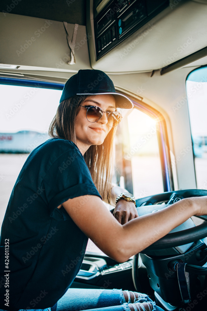 Portrait of beautiful young woman professional truck driver sitting and  driving big truck. Inside of vehicle. People and transportation concept.  Photos | Adobe Stock