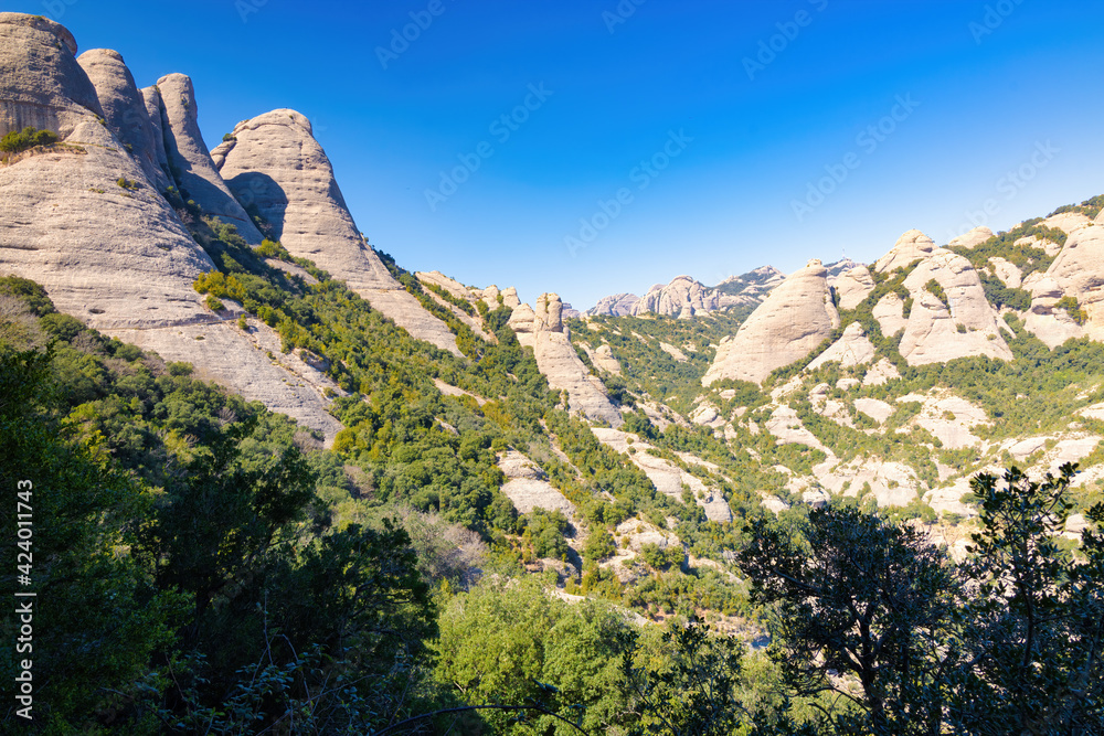 View from the French pass of the Sierra of Alcines Paparres with the Saint Jeroni peak in the background. Montserrat massif natural park, Catalonia, Spain