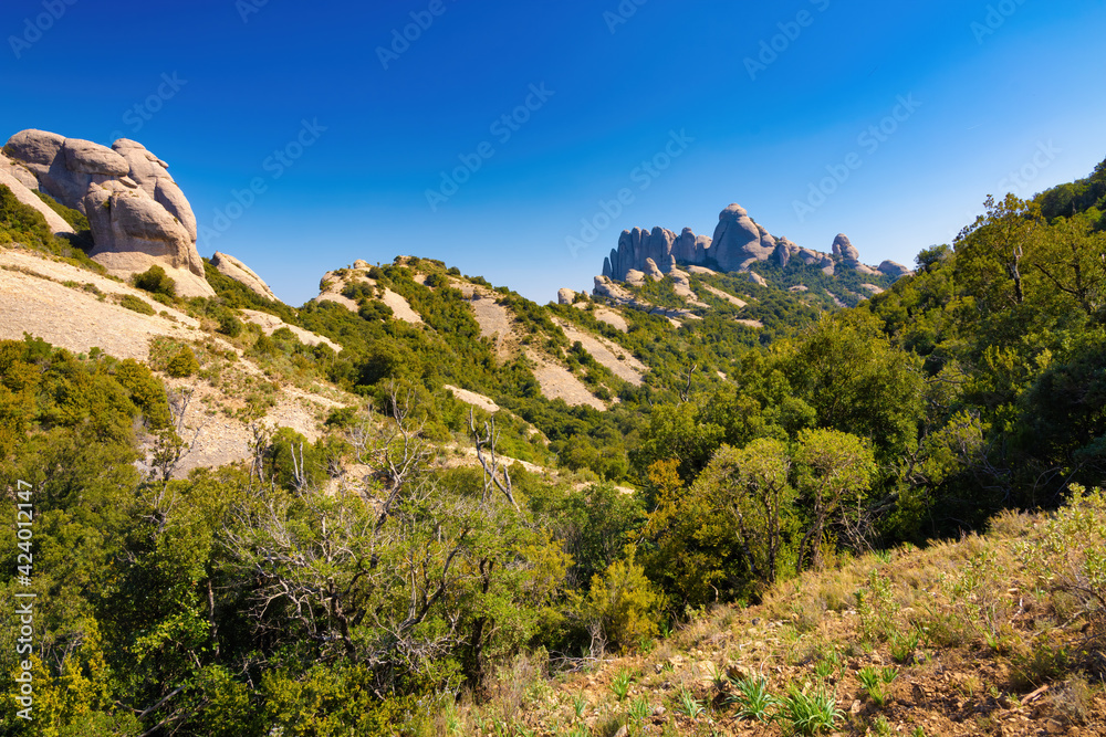 View of the Lluerners mountain range from the Saint Joan funicular path to the Saint Jeroni hermitage. Montserrat massif natural park, Catalonia, Spain