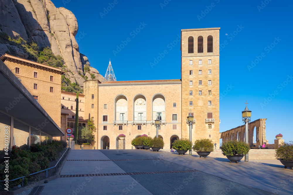 View of the main facade of Plaza de Santa Maria from the Basilica of Montserrat. Tourist-religious complex of the Monastery of Montserrat, Catalonia, Spain
