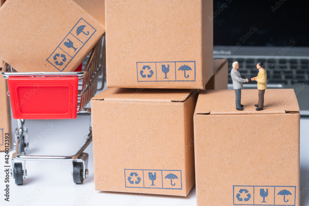 miniature people sitting on parcel box, online shopping concept