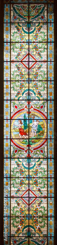 Different details of a luxurious theater with gold touches and stained glass