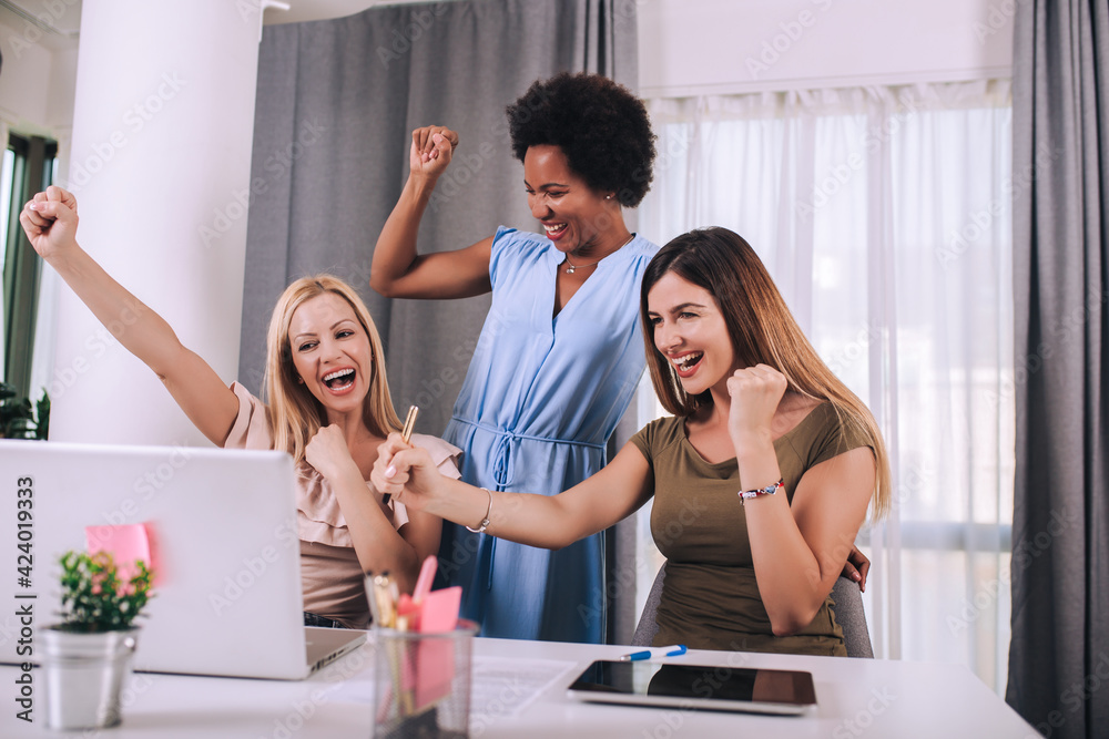 Beautiful young businesswomen working together in office Beautiful young businesswomen working together in office