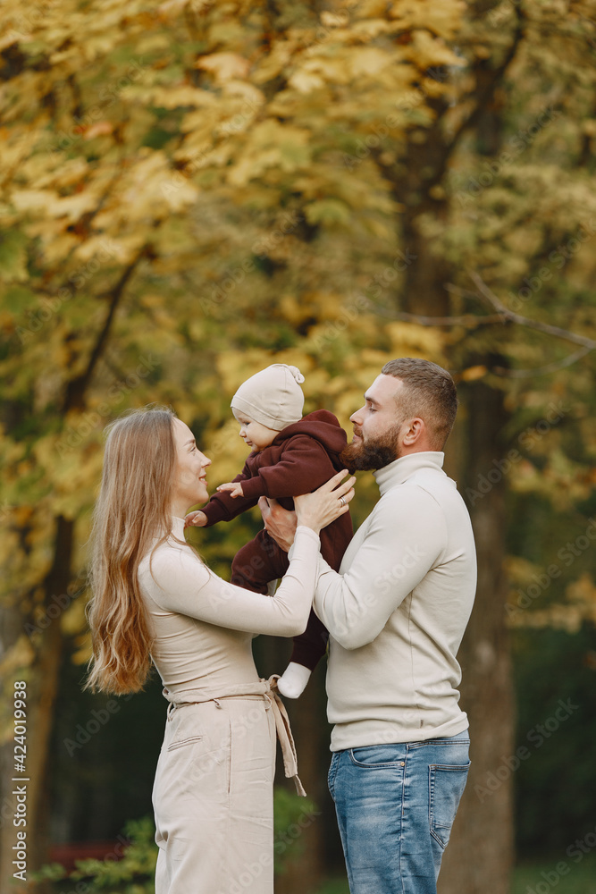 Family with little daughter in a autumn park Family with little daughter in a autumn park