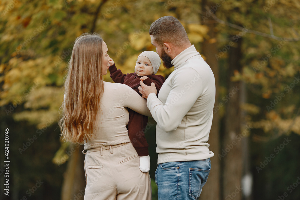 Family with little daughter in a autumn park Family with little daughter in a autumn park