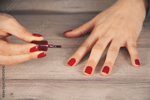 woman hand nail varnish