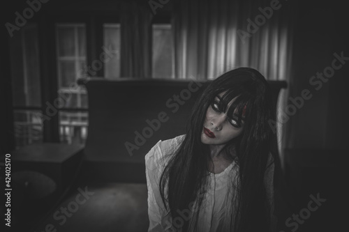 Portrait of asian woman make up ghost,Scary horror scene for background,Halloween festival concept,Ghost movies poster