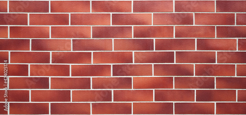 a wall made of red brick in various shades creating a pattern