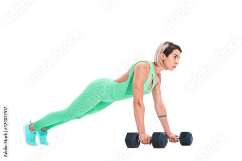 woman doing plank exercise on dumbbells isolated over white background