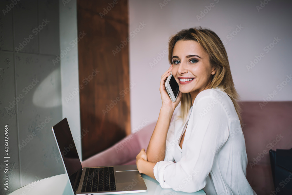 Lady working remotely on laptop while sitting at cafe Lady working remotely on laptop while sitting at cafe