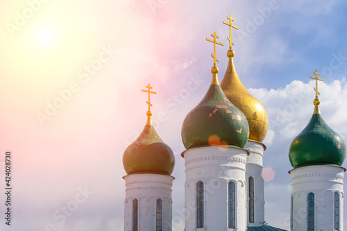 Russian Christian Orthodox church with domes and a cross against the sky. Russian Orthodoxy and Christian Faith concept.