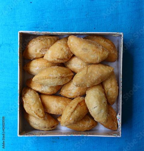 Traditional Indian sweet, Gujiya, inside a box