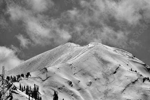 Skiers hiking up the Highlands Bowl