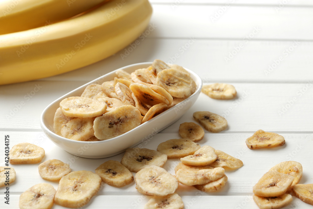 banana chips, dried fruit on a wooden table. Dried fruit as healthy snack. Healthy breakfast banana chips, dried fruit on a wooden table. Dried fruit as healthy snack. Healthy breakfast