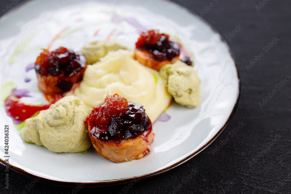 Salmon medallions with mashed potatoes and sauce Salmon medallions with mashed potatoes and sauce