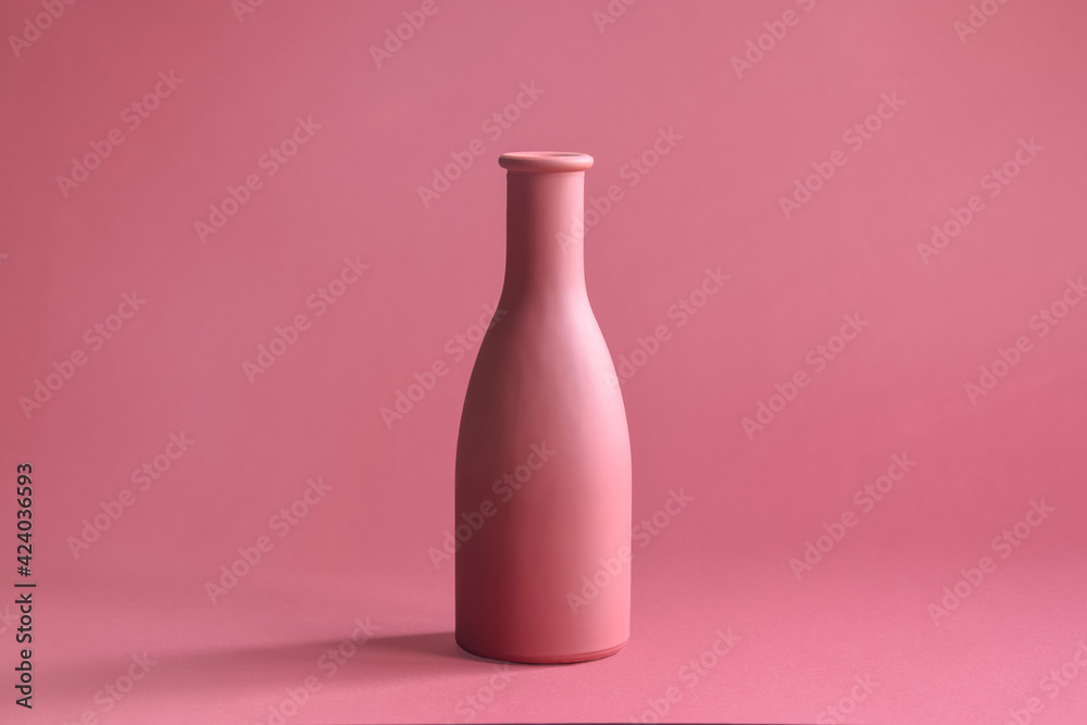 One stylish pink flower vase on pink background. Close-up. Copy space. Selective focus. One stylish pink flower vase on pink background. Close-up. Copy space. Selective focus.