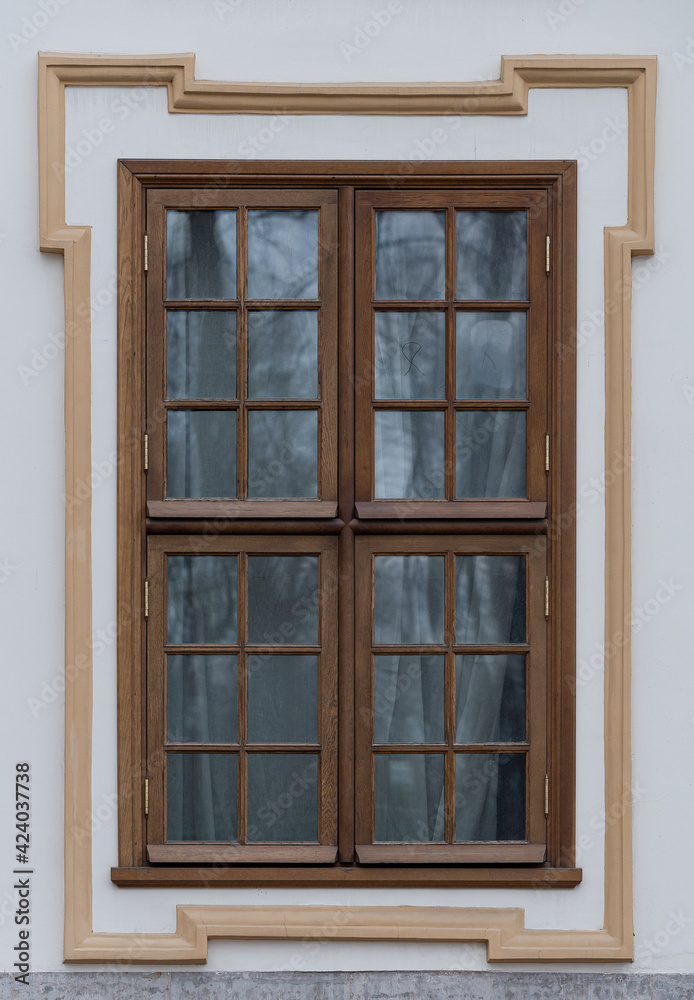  Windows in the city in the old style, with stucco, decorative elements