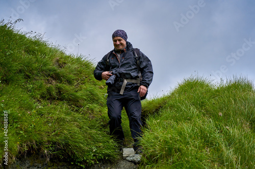 Professional nature photographer in the mountains