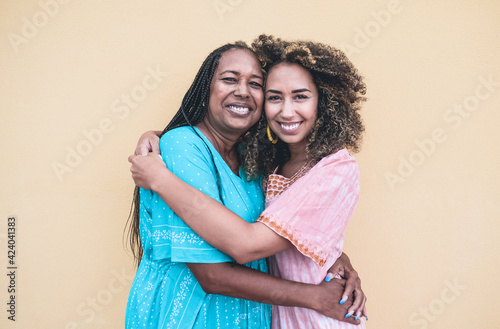 Portrait of cheerful african mother and adult daughter together - Family, mother and child love