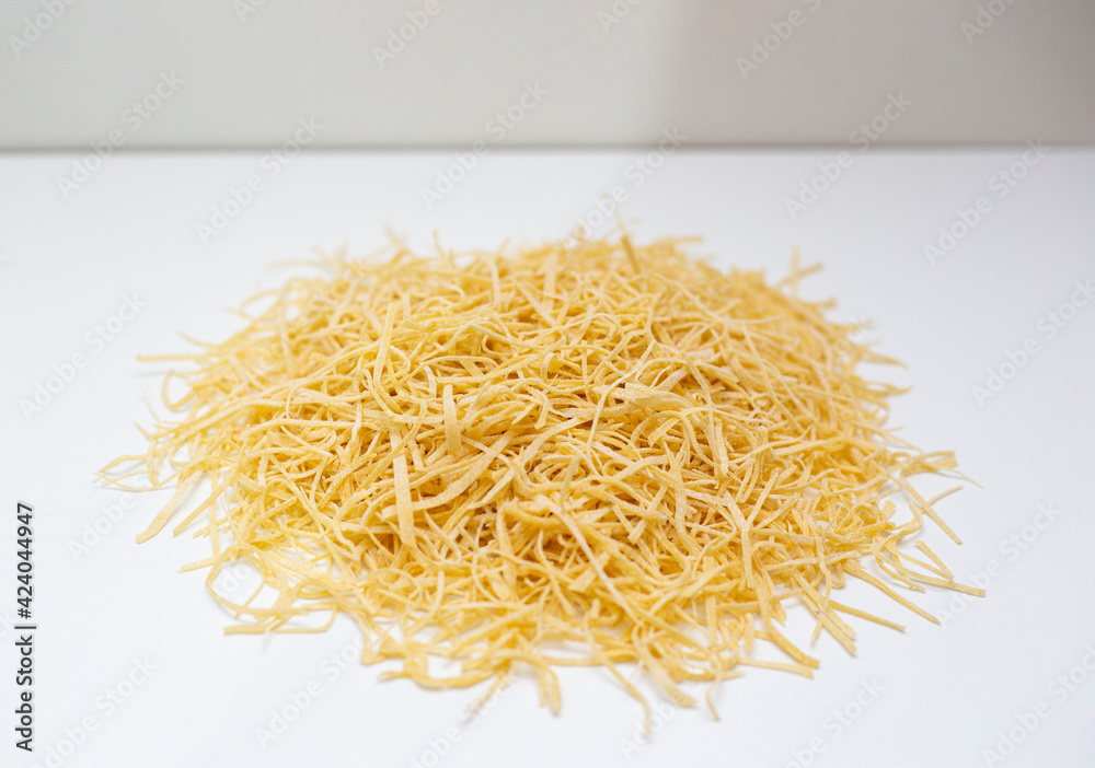 Homemade noodles on a white background.