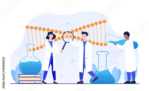 Male and female scientists working with huge DNA chain in lab