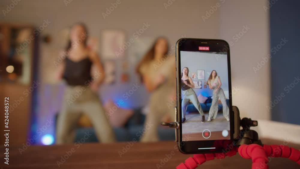 Teenagers womans shooting together dancing at home when making video for social media, stories hip hop popular trandy dance, students at home make content Teenagers womans shooting together dancing at home when making video for social media, stories hip hop popular trandy dance, students at home make content