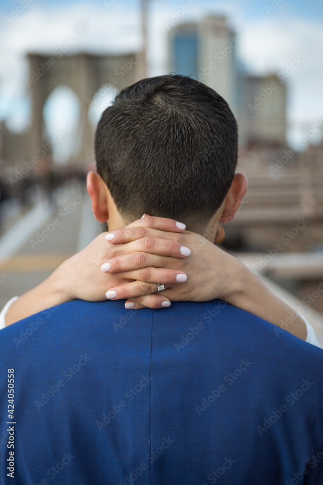 back view of bride holding groom back view of bride holding groom