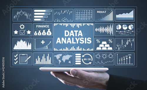 Man holding tablet computer. Data Analysis. Profit charts and stock market trends analysis. Business. Finance