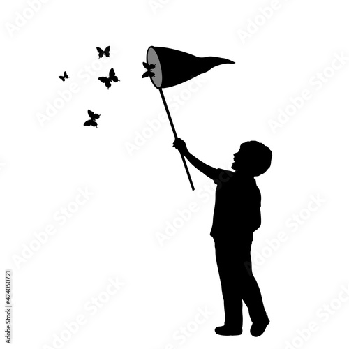 Silhouette little boy catches butterflies