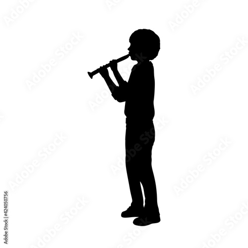 Silhouette boy playing the flute.