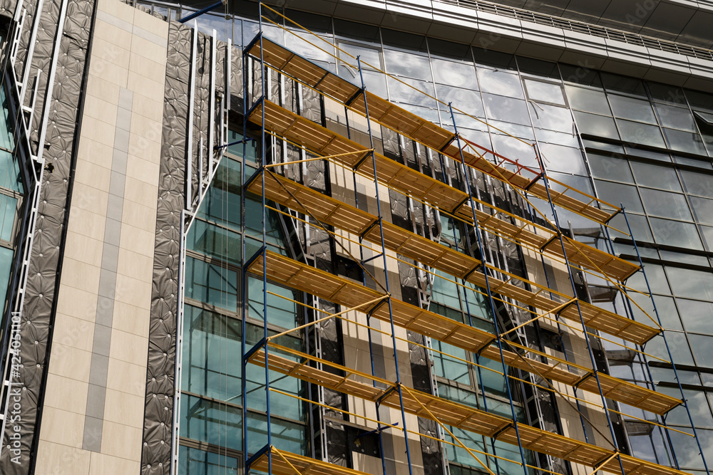 scaffolding and rafters of a part of the building during renovation ...